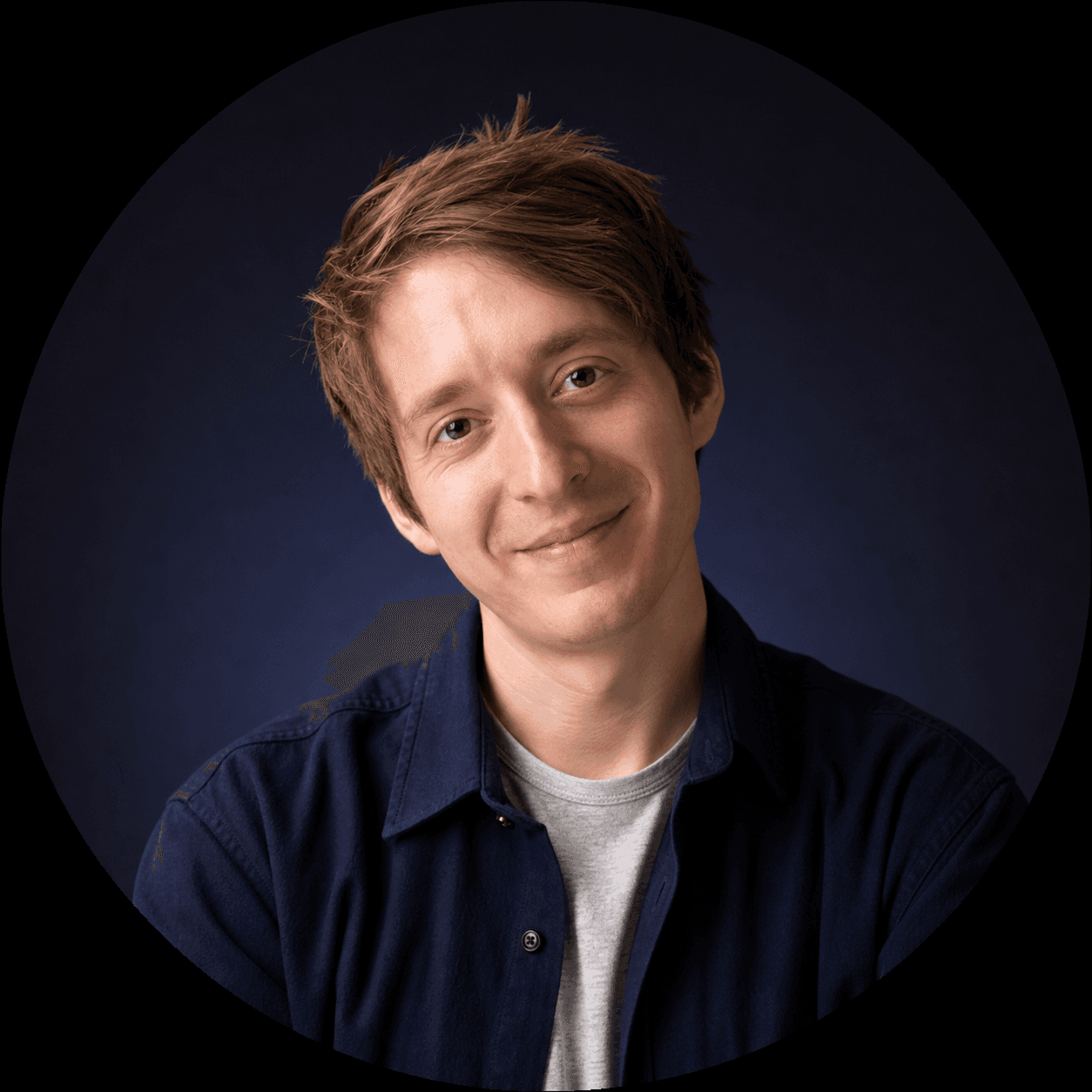 Connor smiling against a dark navy circular background